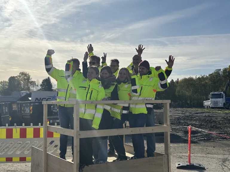 A group of people in yellow jackets